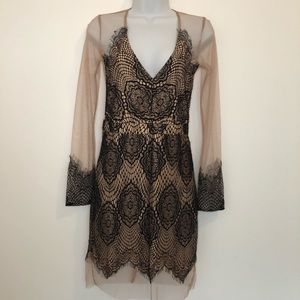 Sheer nude and black lace dress